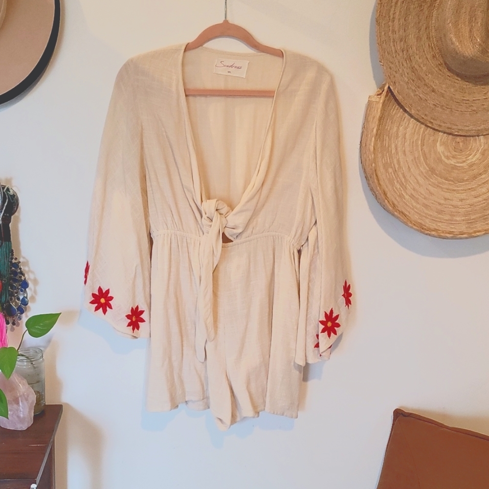 Red floral embroidered cream colored romper sz M/L